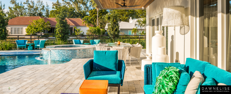 Beautiful indoor outdoor living area designed by Dawn Elise Interiors in Ft. Lauderdale, Florida, using Seasonal Living Trading Company furniture and accessories